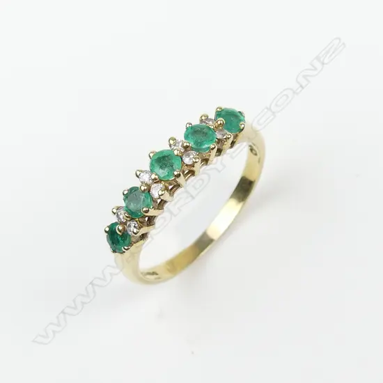 An 18ct gold emerald and diamond ring