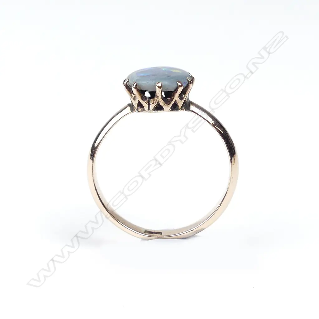 A 9ct rose gold and black opal ring Image 1++