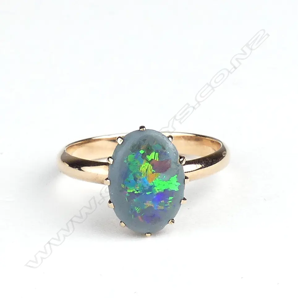 A 9ct rose gold and black opal ring Image 1++