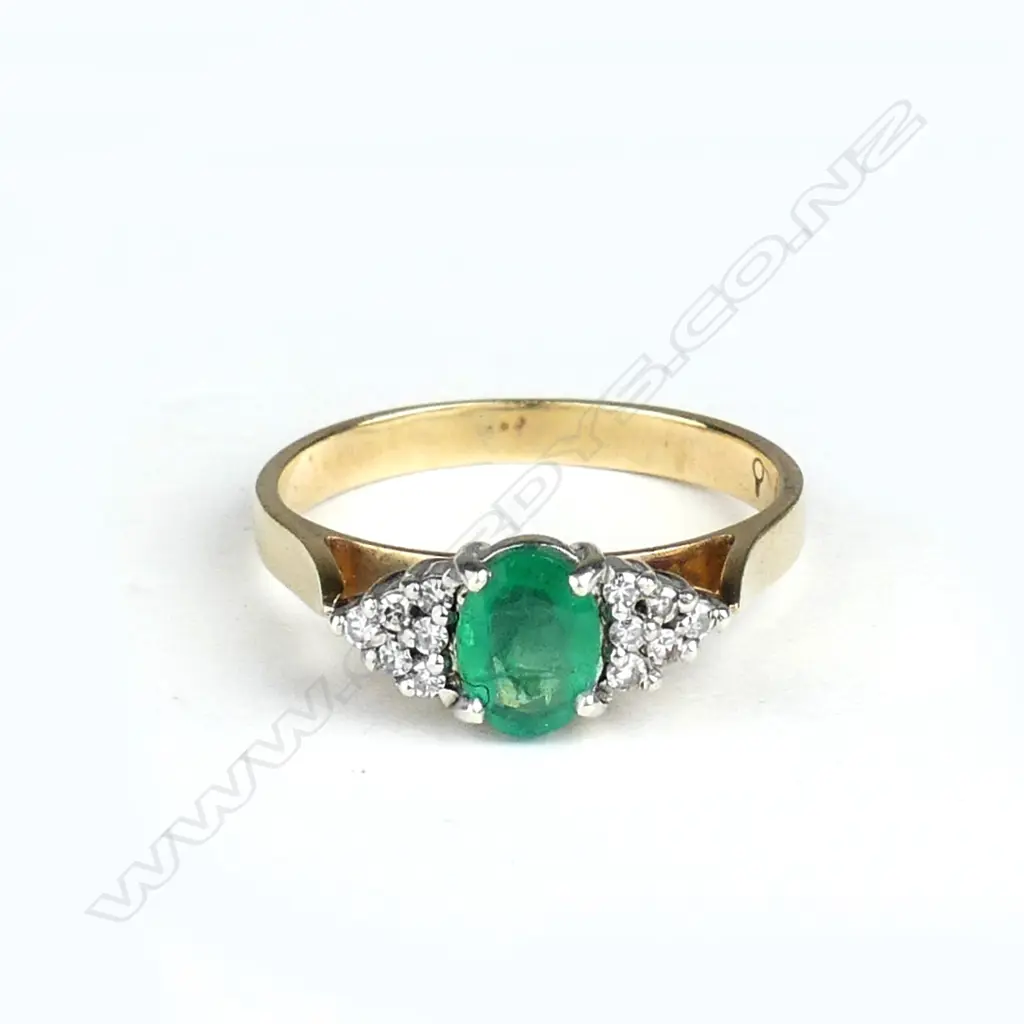 A 9ct gold emerald and diamond ring Image 1++