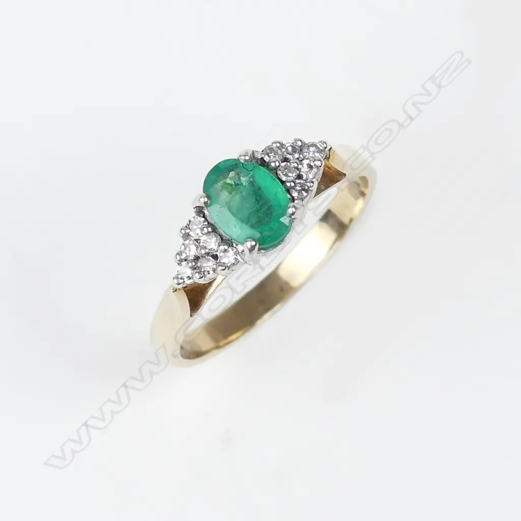 A 9ct gold emerald and diamond ring Image 1++