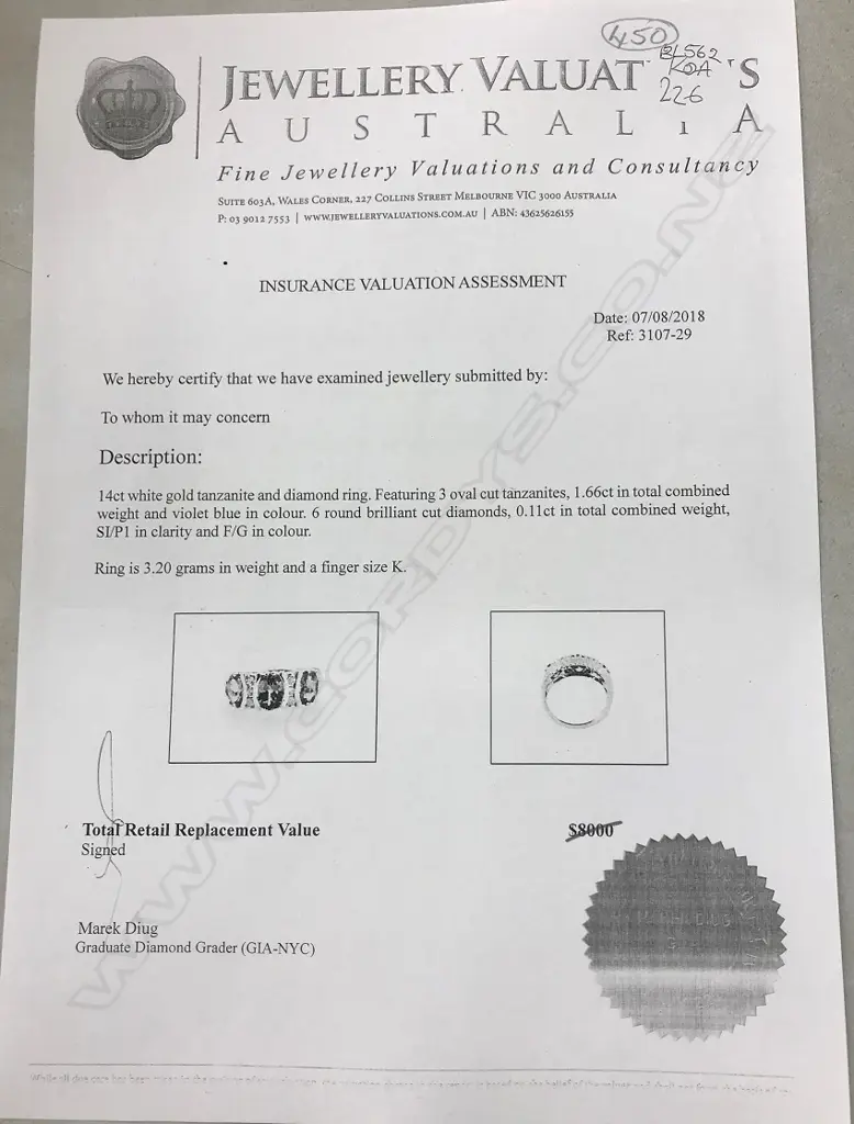 A 14ct white gold tanzanite and diamond ring Image 1++