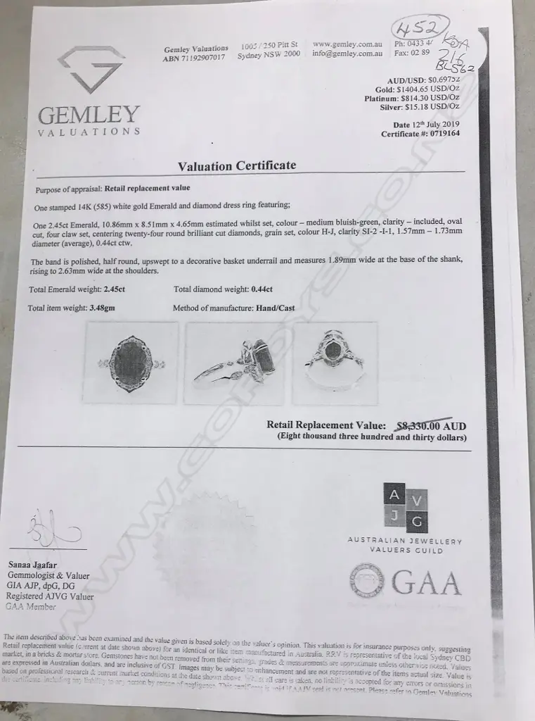 A 14ct white gold emerald and diamond ring Image 1++