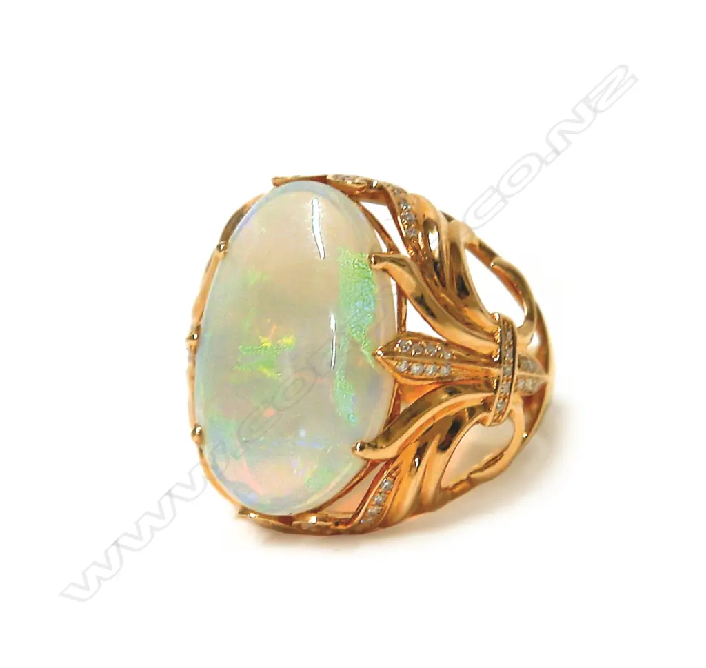 An impressive modern 18ct. rose gold large opal and diamond dress ring Image 1++
