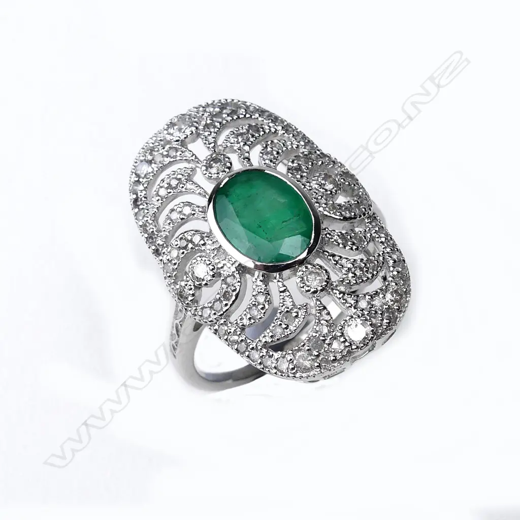An 18ct. white gold emerald and diamond Art Deco style ring Image 1++