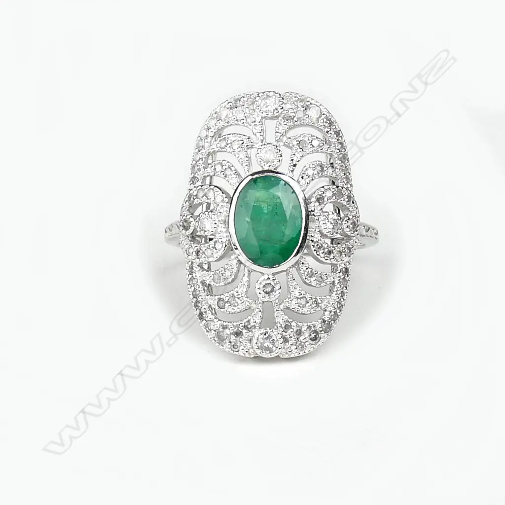An 18ct. white gold emerald and diamond Art Deco style ring Image 1++