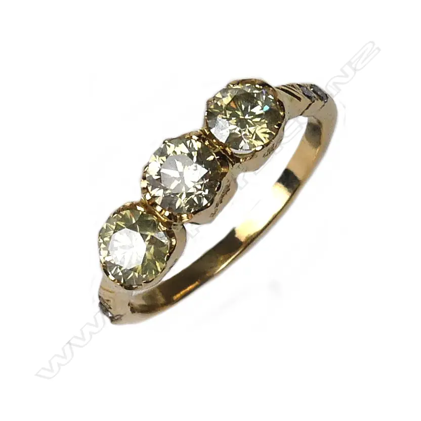 An 18ct gold and diamond trilogy ring Image 1++