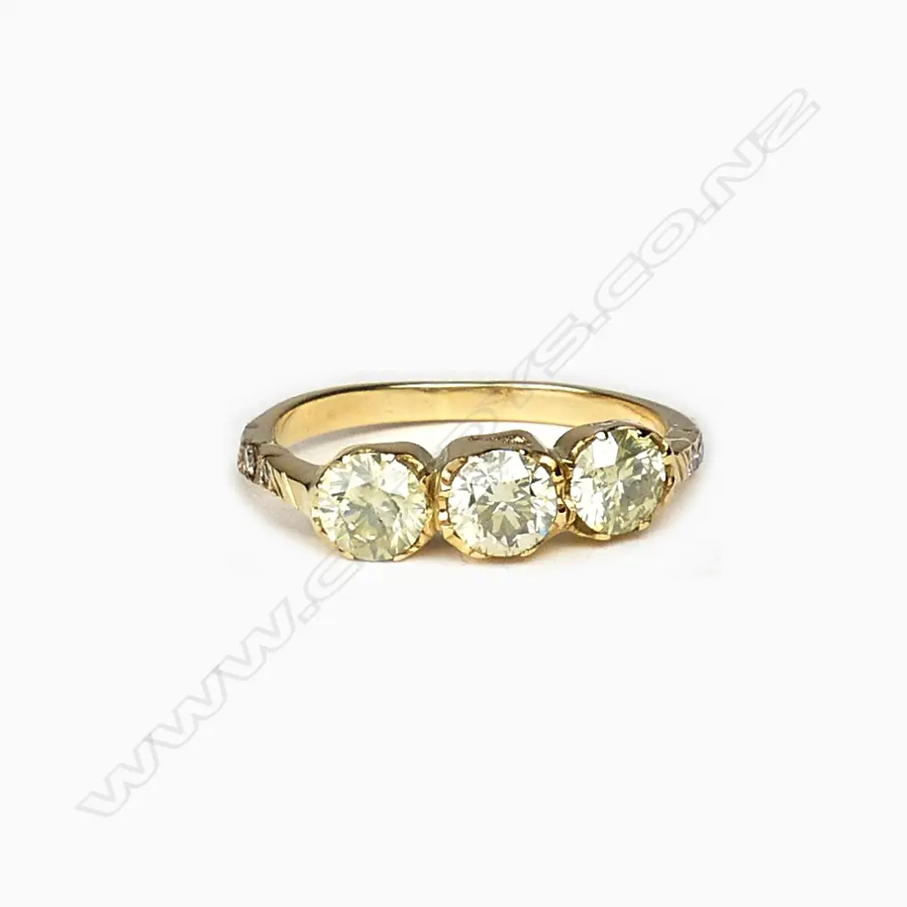 An 18ct gold and diamond trilogy ring Image 1++