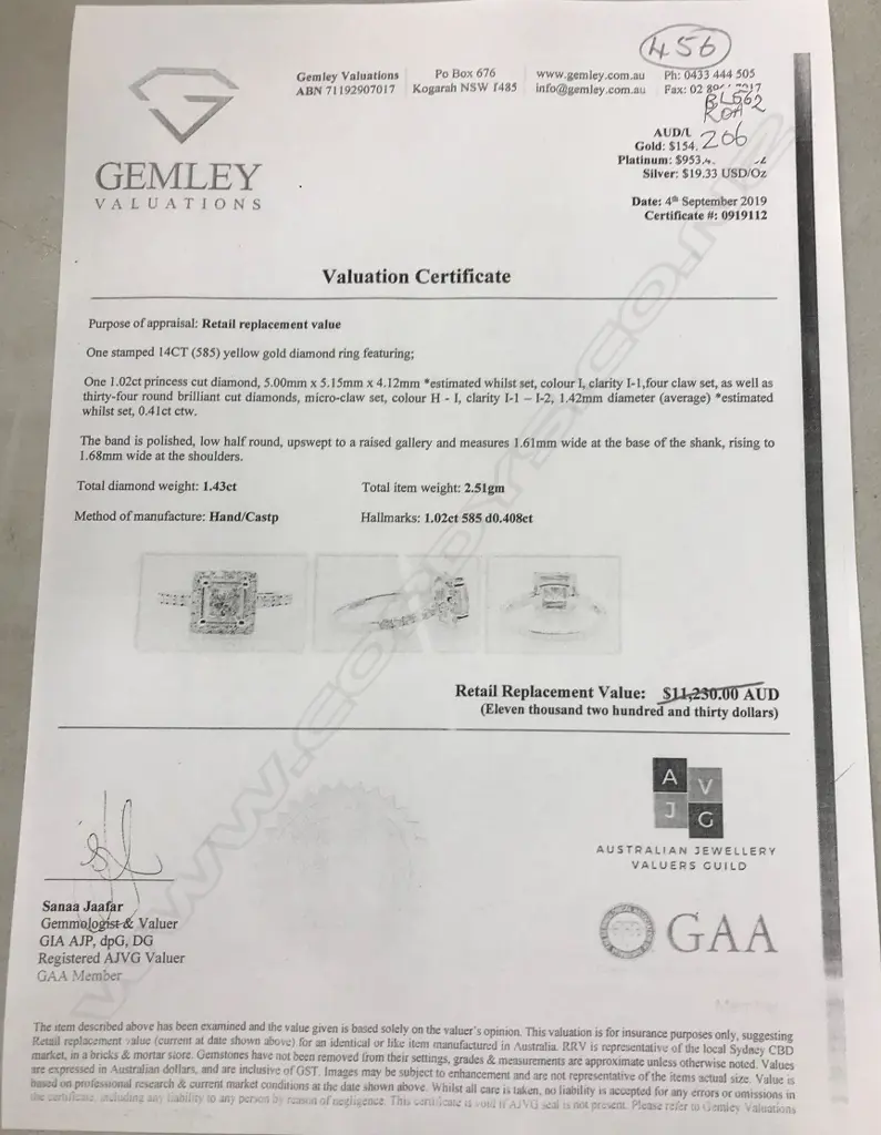 A 14ct gold and diamond halo ring Image 1++