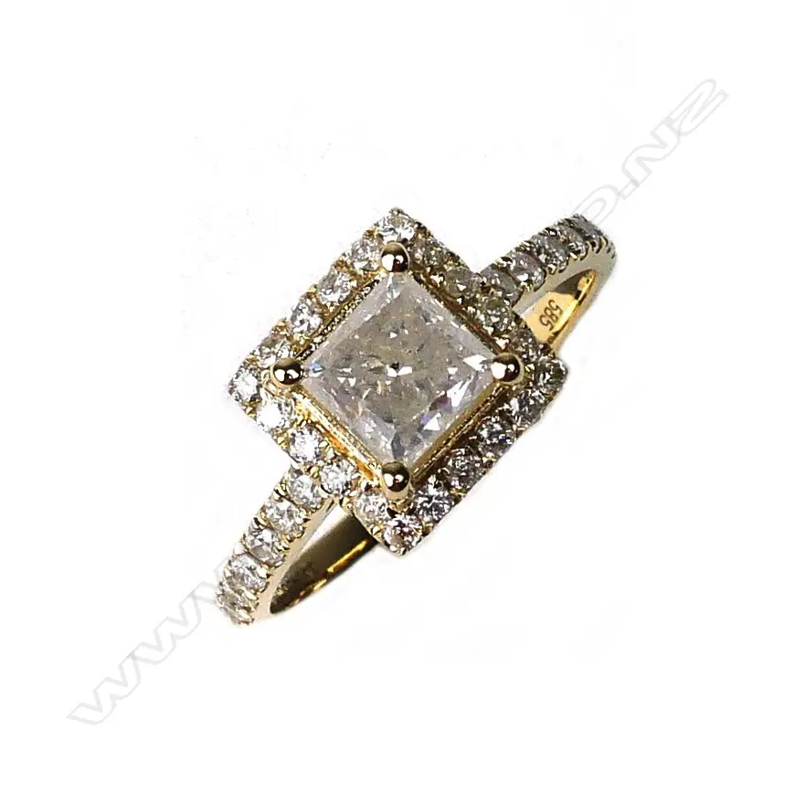 A 14ct gold and diamond halo ring Image 1++