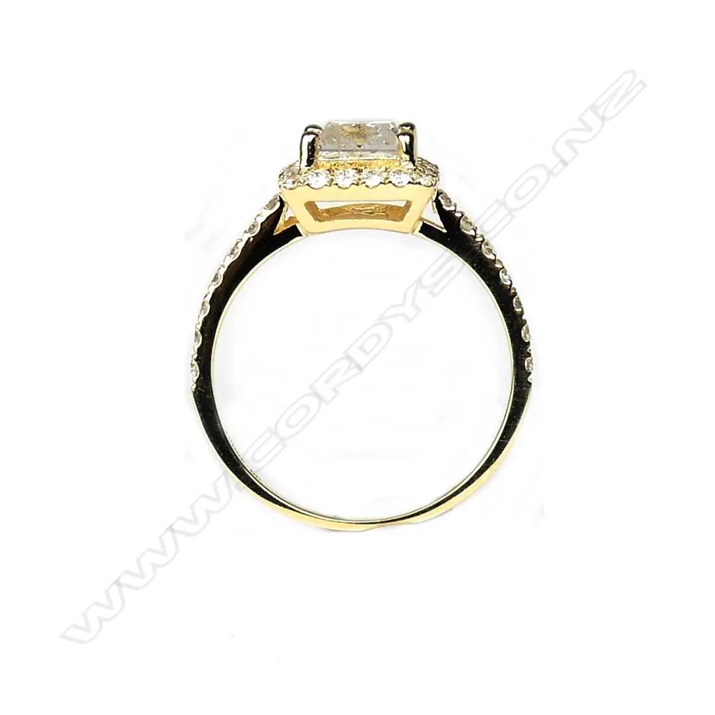 A 14ct gold and diamond halo ring Image 1++