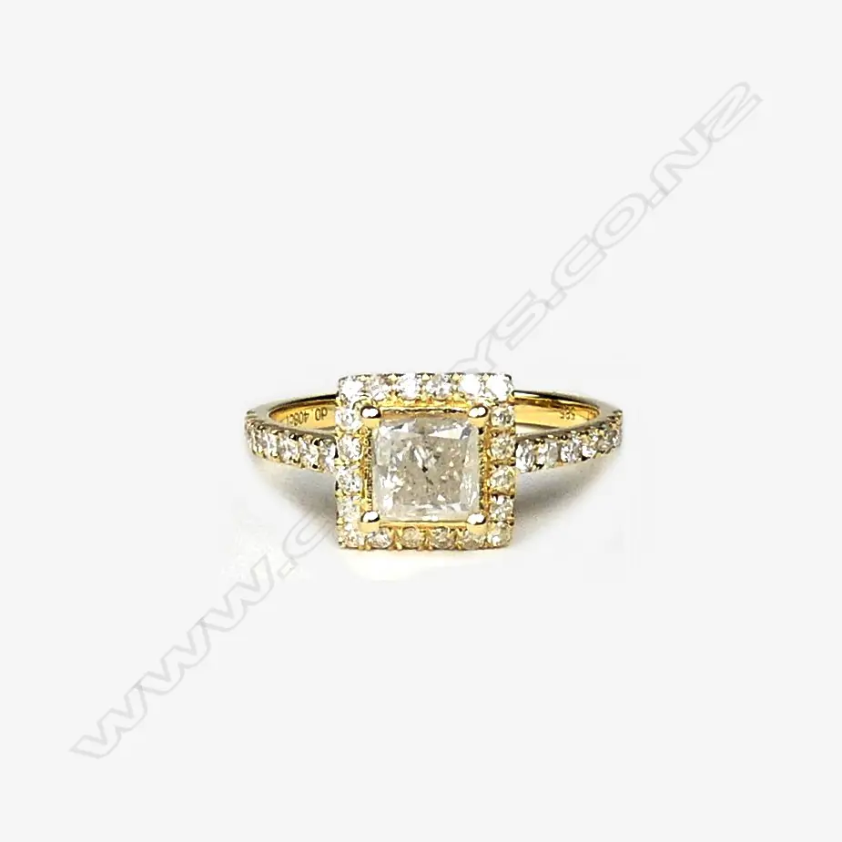 A 14ct gold and diamond halo ring Image 1++