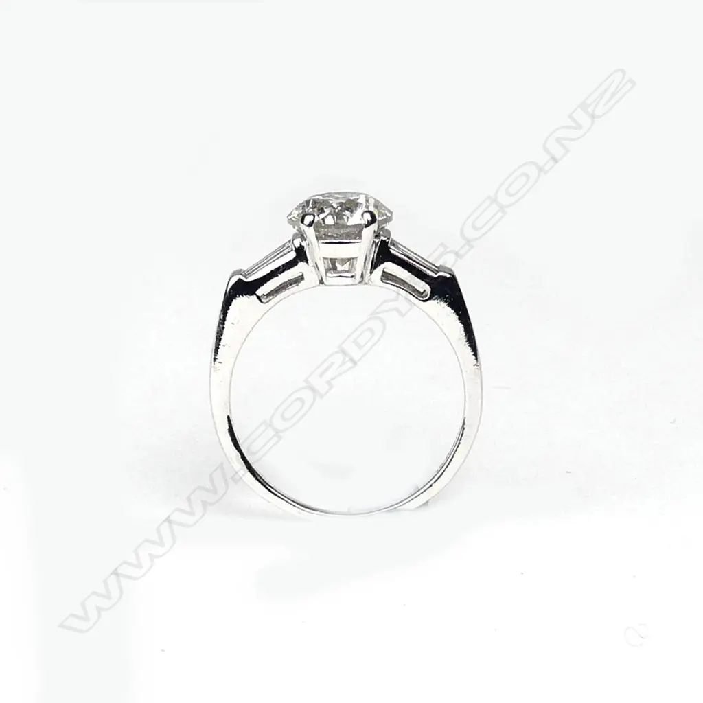 A platinum and diamond solitaire ring Image 1++