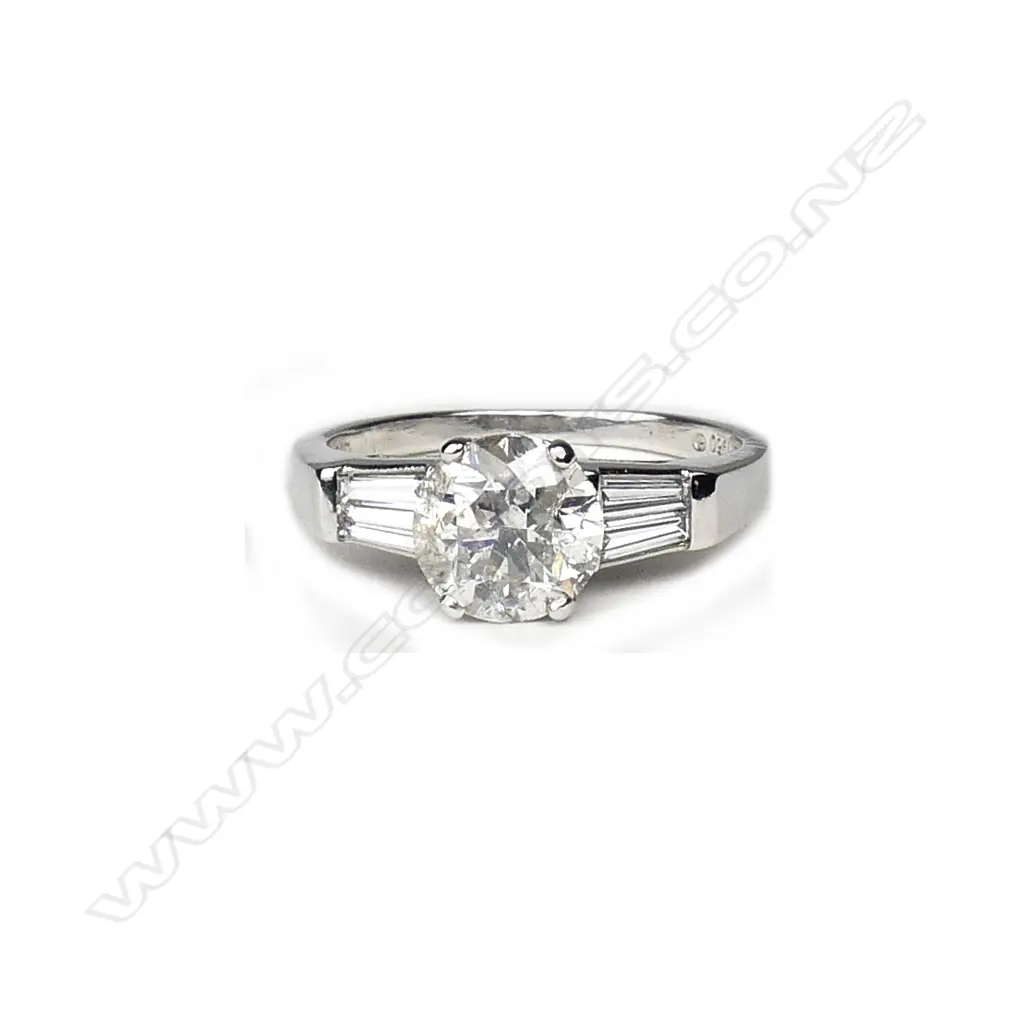 A platinum and diamond solitaire ring Image 1++