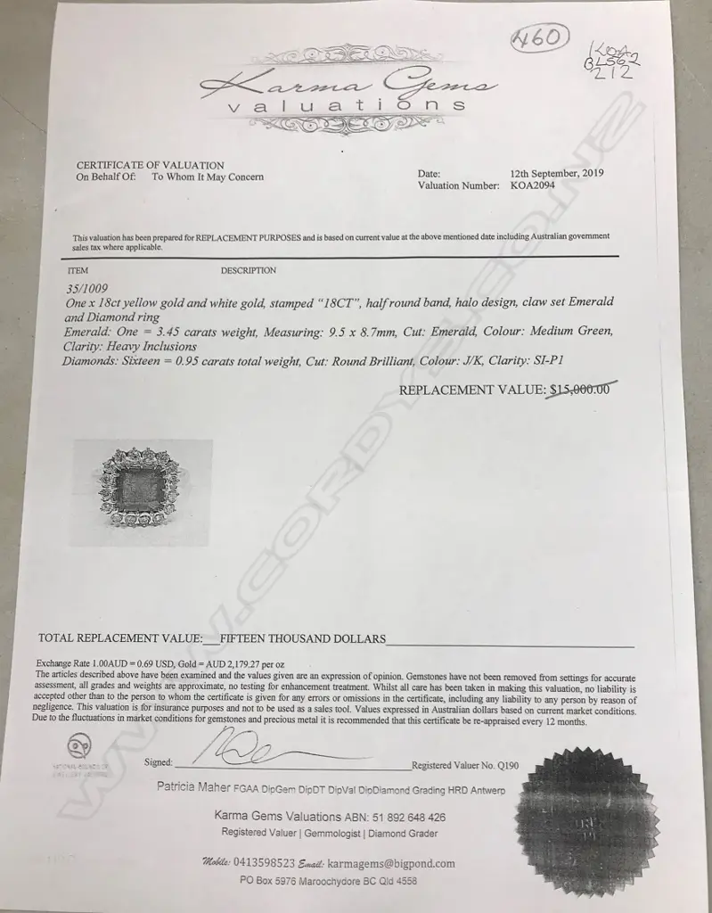 An 18ct yellow and white gold emerald and diamond ring Image 1++