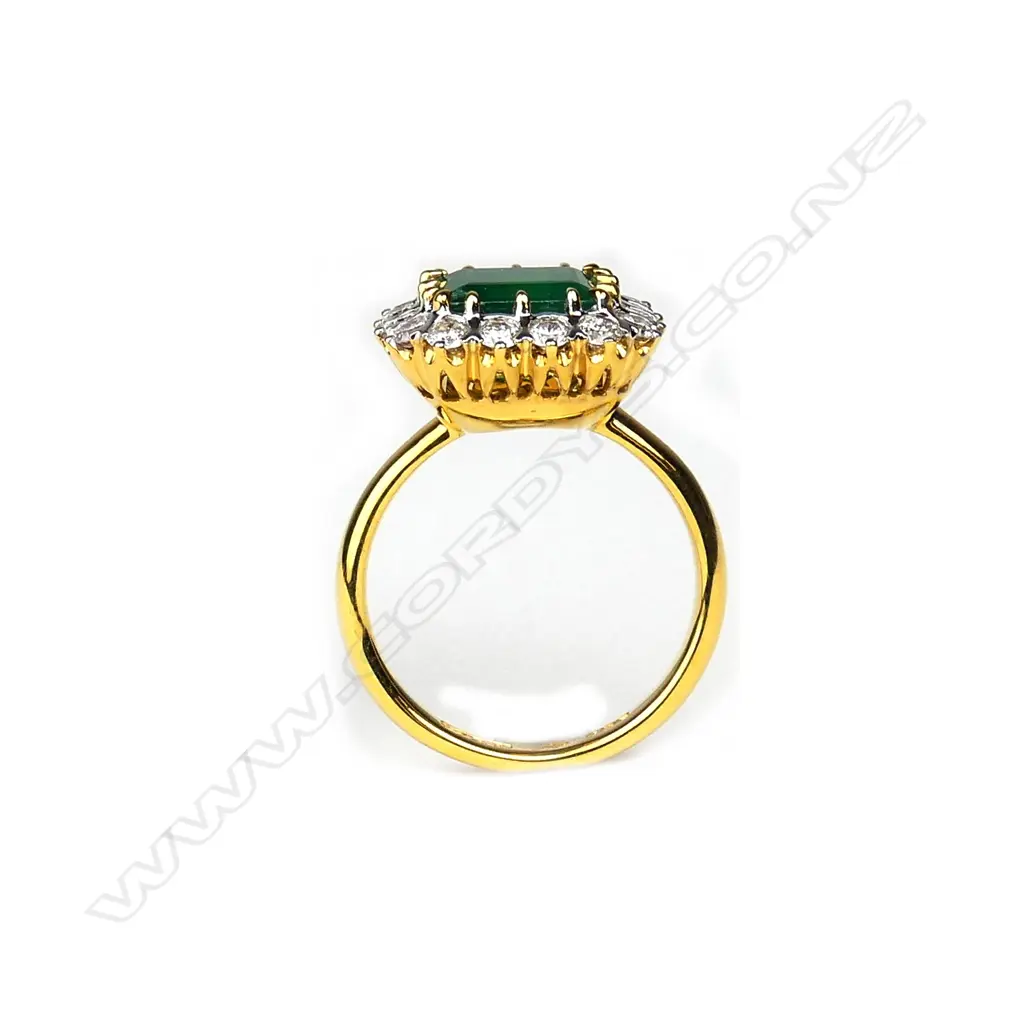 An 18ct yellow and white gold emerald and diamond ring Image 1++