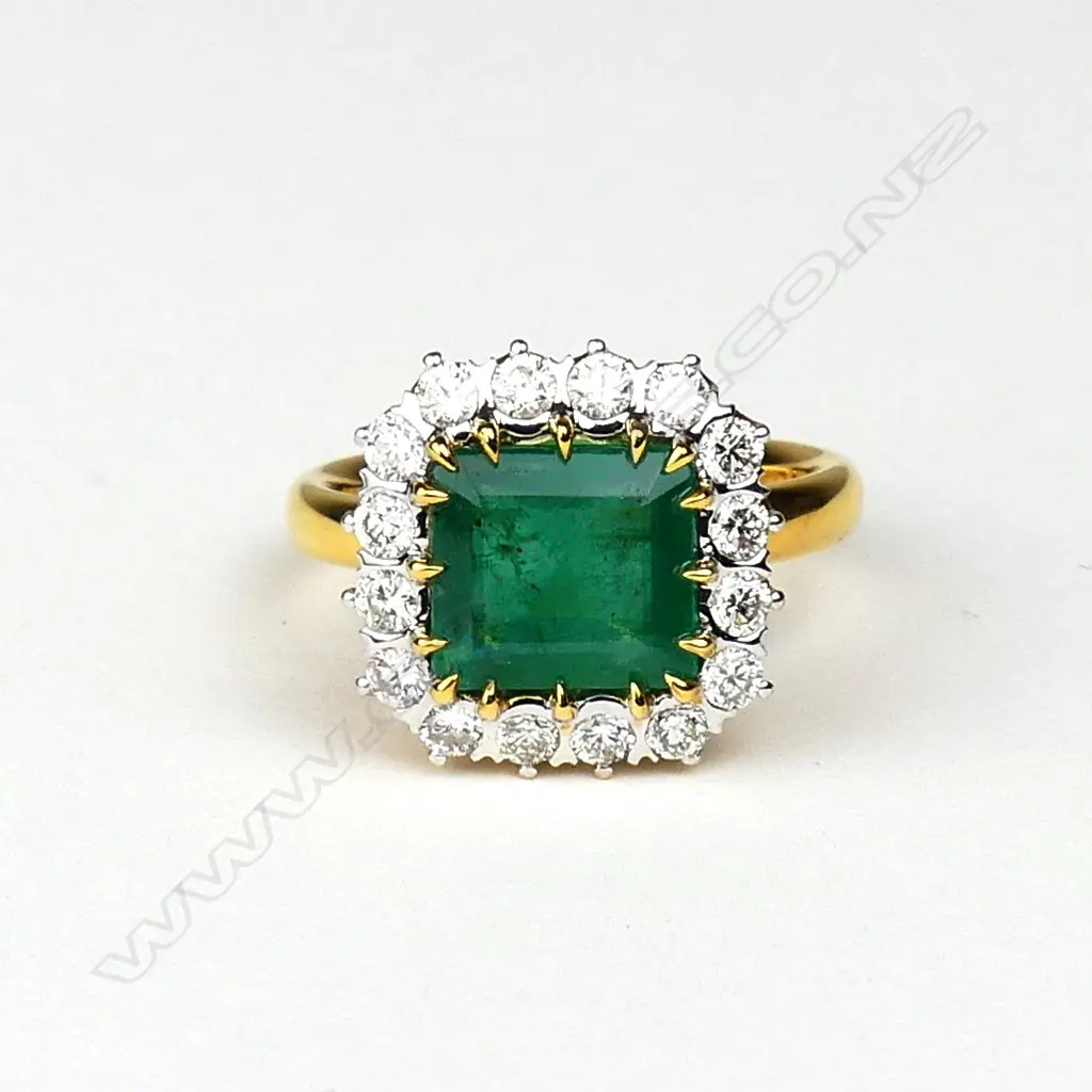 An 18ct yellow and white gold emerald and diamond ring Image 1++
