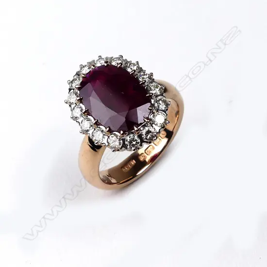 A 22ct rose and white gold ruby and diamond ring