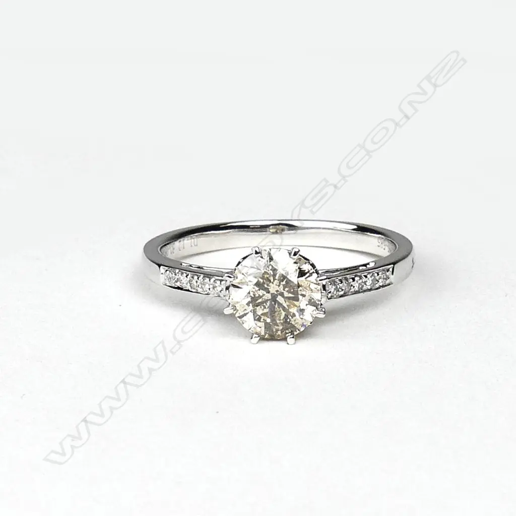 A 14ct white gold and diamond solitaire ring Image 1++