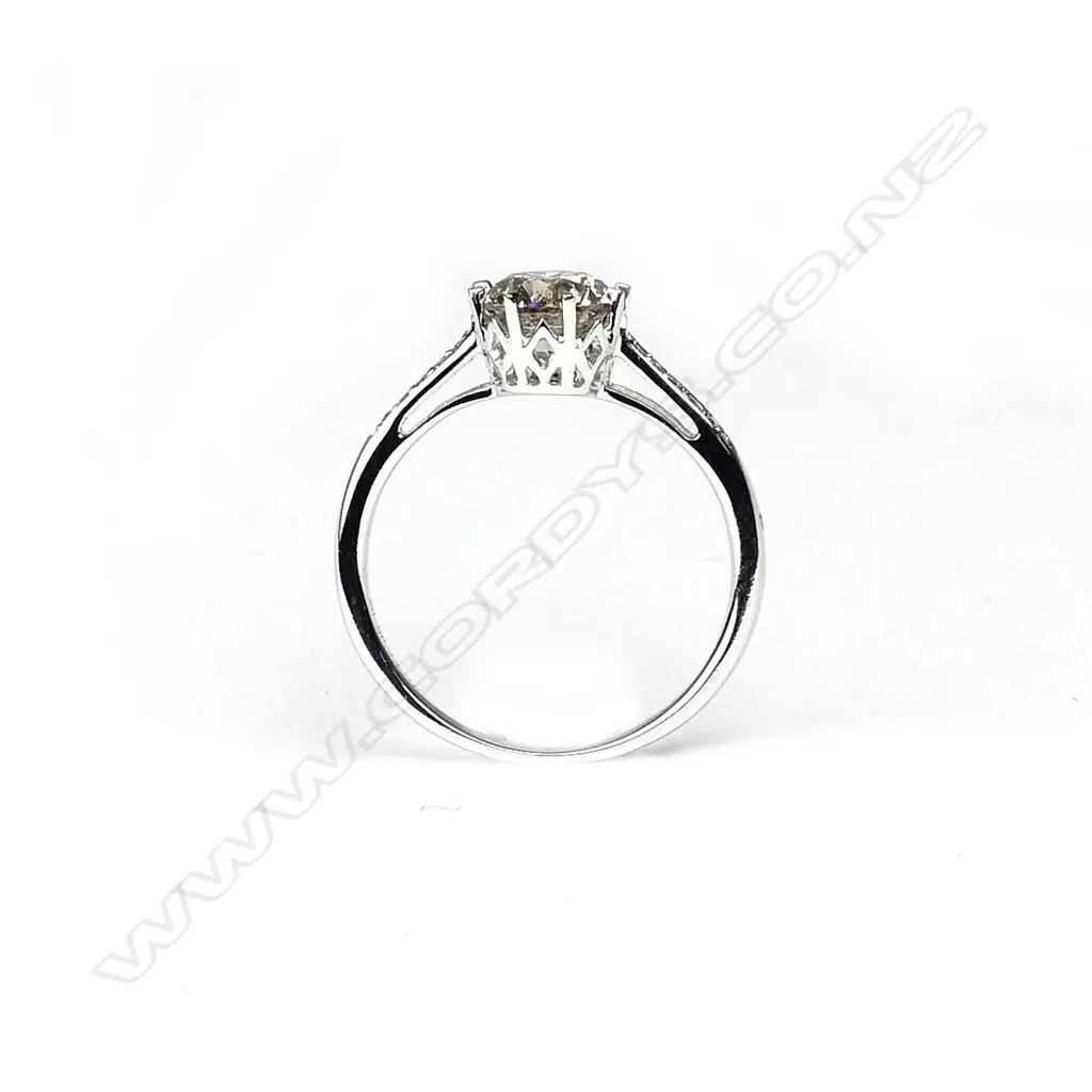 A 14ct white gold and diamond solitaire ring Image 1++