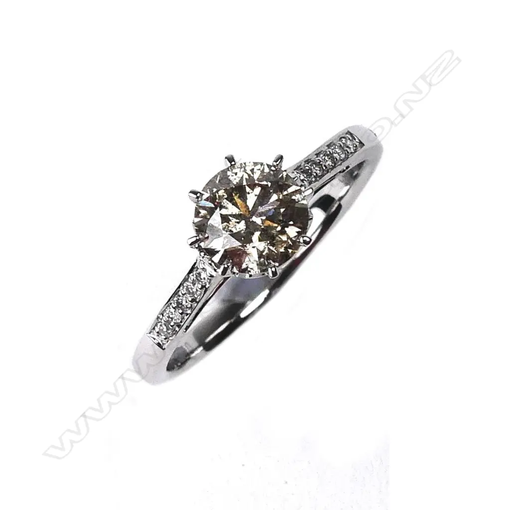 A 14ct white gold and diamond solitaire ring Image 1++
