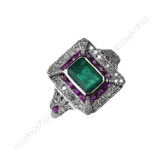 An 18ct white gold emerald ruby and diamond Art Deco style ring