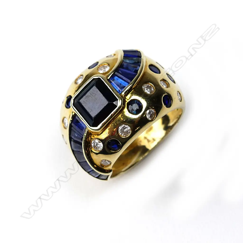 A 14ct gold sapphire and diamond ring Image 1++