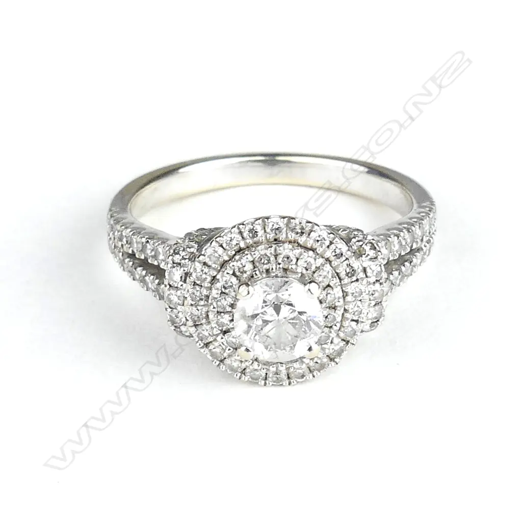 A 14ct. white gold and diamond cluster ring Image 1++