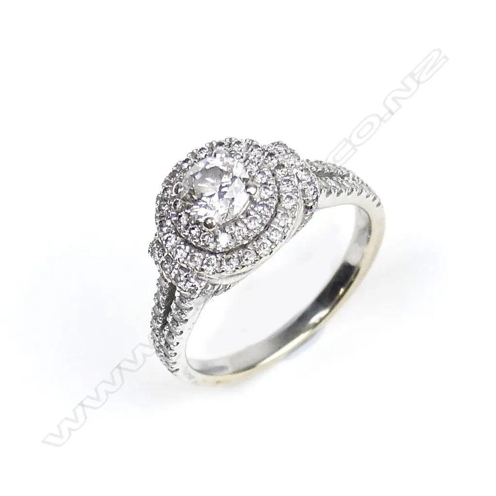 A 14ct. white gold and diamond cluster ring Image 1++