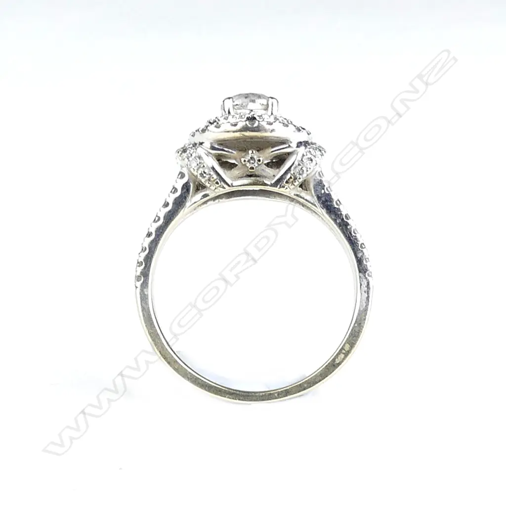 A 14ct. white gold and diamond cluster ring Image 1++