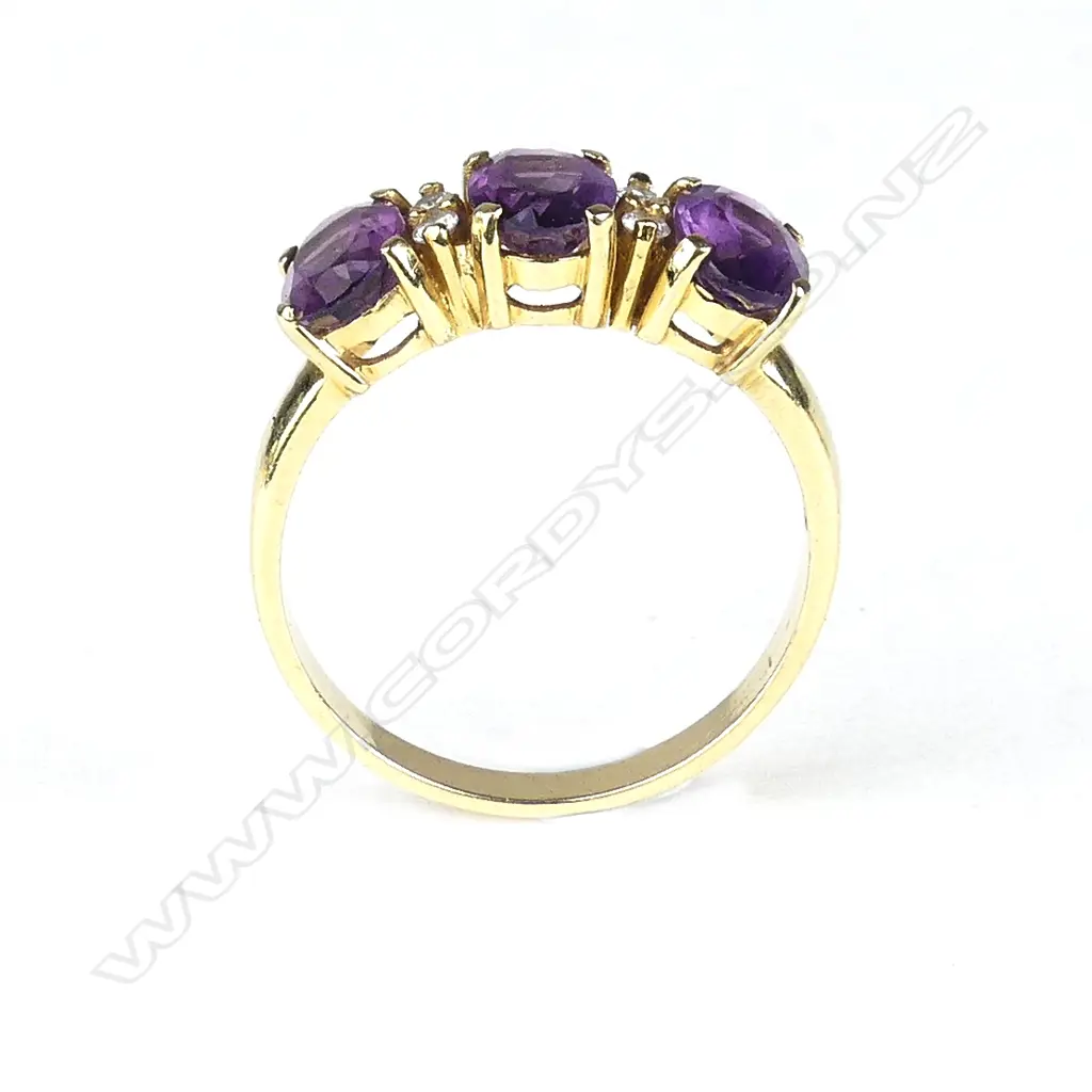 An 18ct. yellow gold amethyst and diamond vintage ring Image 1++