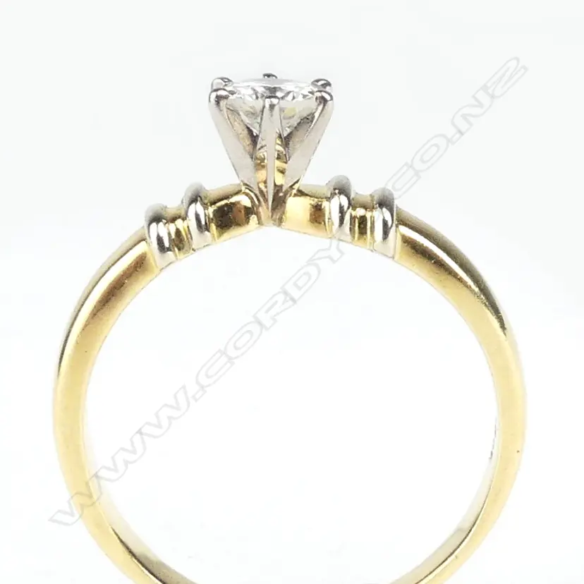 An 18ct. yellow gold and diamond solitaire ring Image 1++
