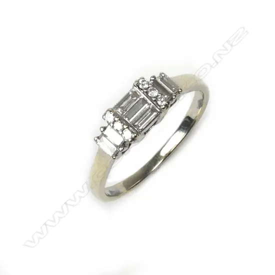 A vintage lady's 18ct. white gold and baguette diamond ring