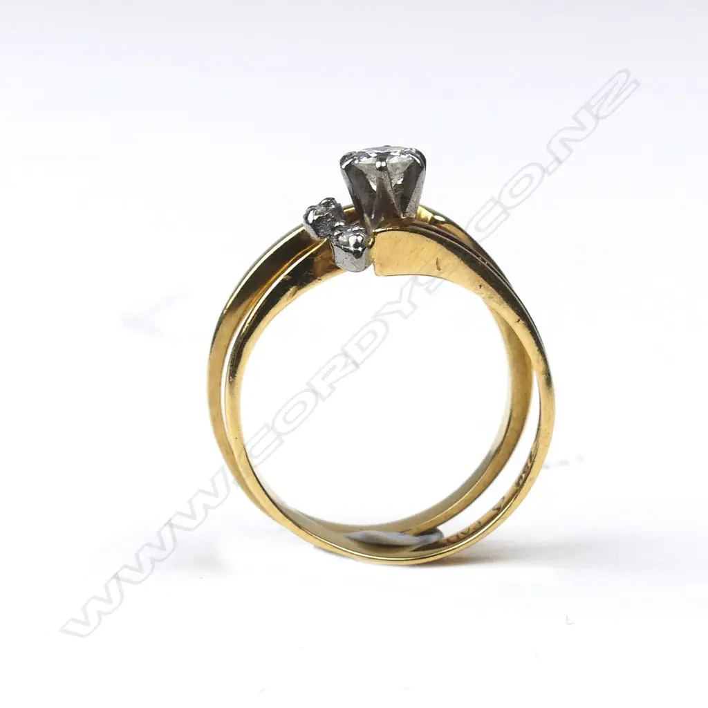 A pair of 18ct gold and diamond rings Image 1++