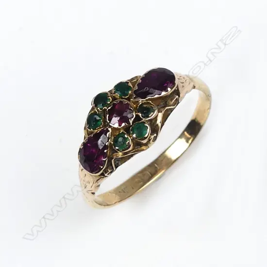 A 19thC yellow gold garnet and emerald lady's dress ring