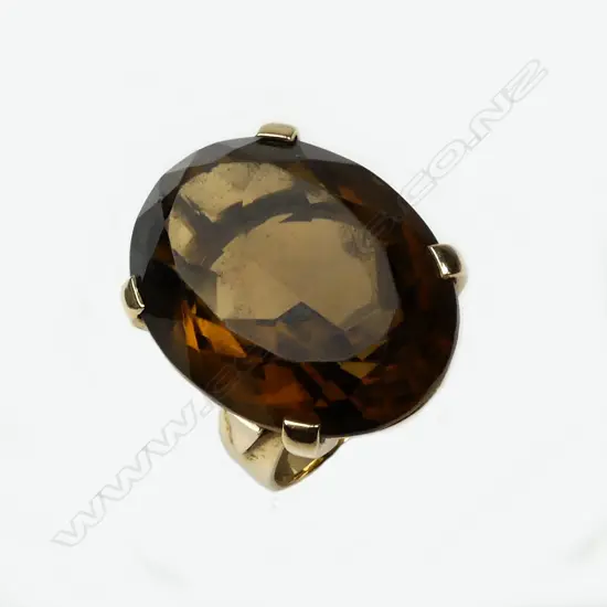 A 9ct. gold and large smoky quartz lady's dress ring