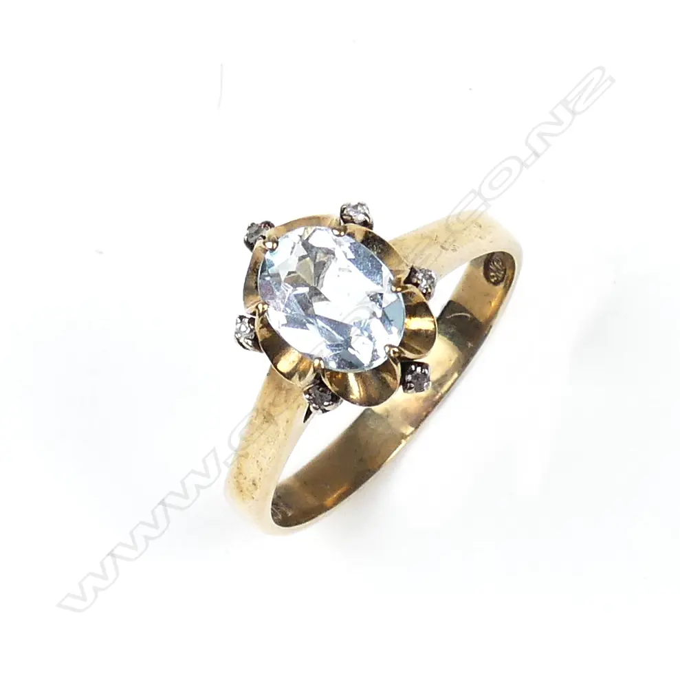 A 9ct gold aquamarine and diamond ring Image 1++