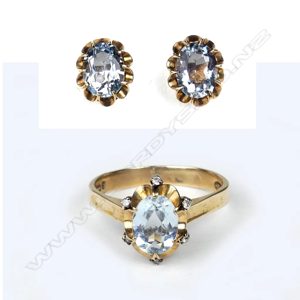 A 9ct gold aquamarine and diamond ring Image 1++