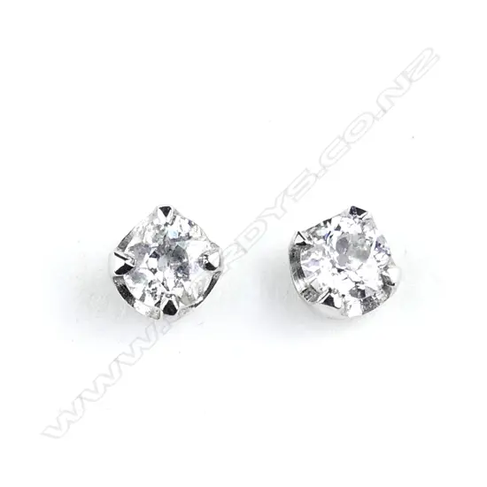 A pair of 9ct white gold and diamond stud earrings