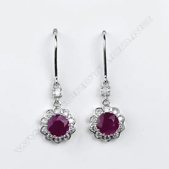 A pair of 14ct white gold ruby and diamond drop earrings