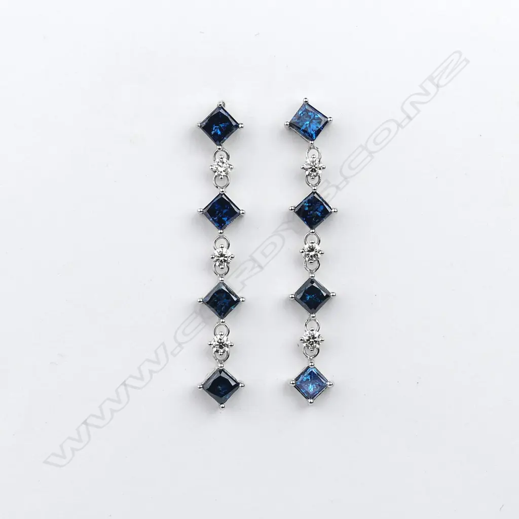 A pair of 14ct white gold and diamond drop earrings Image 1++