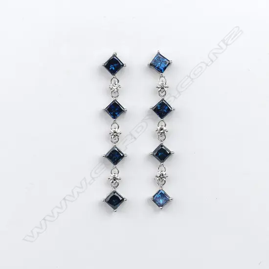 A pair of 14ct white gold and diamond drop earrings