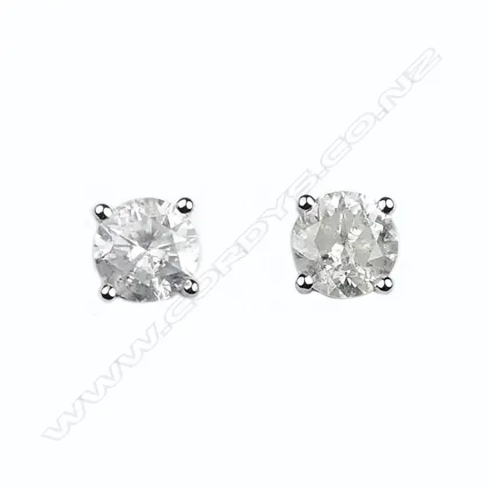 A pair of 14ct white gold and diamond stud earrings