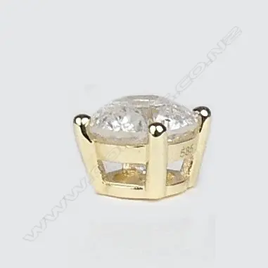 A pair of 14ct gold and diamond stud earrings Image 1++
