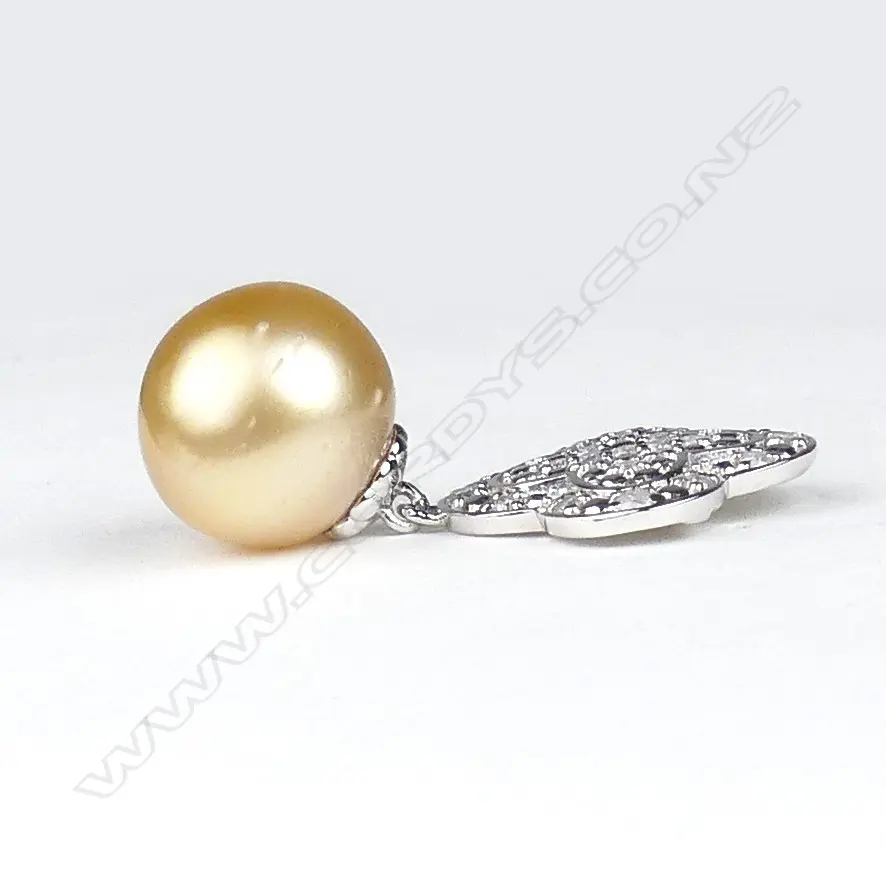 A pair of 14ct white gold pearl and diamond drop earrings Image 1++