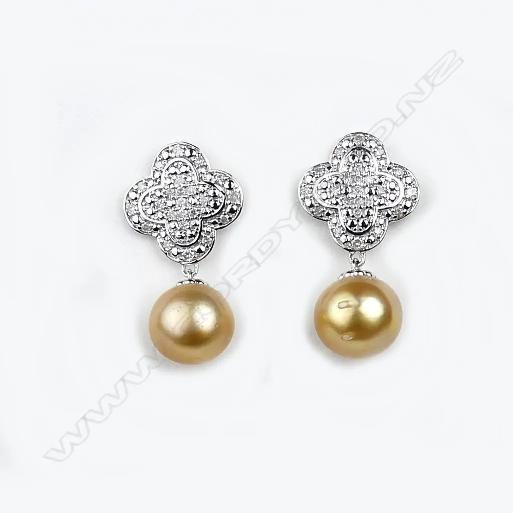 A pair of 14ct white gold pearl and diamond drop earrings Image 1++