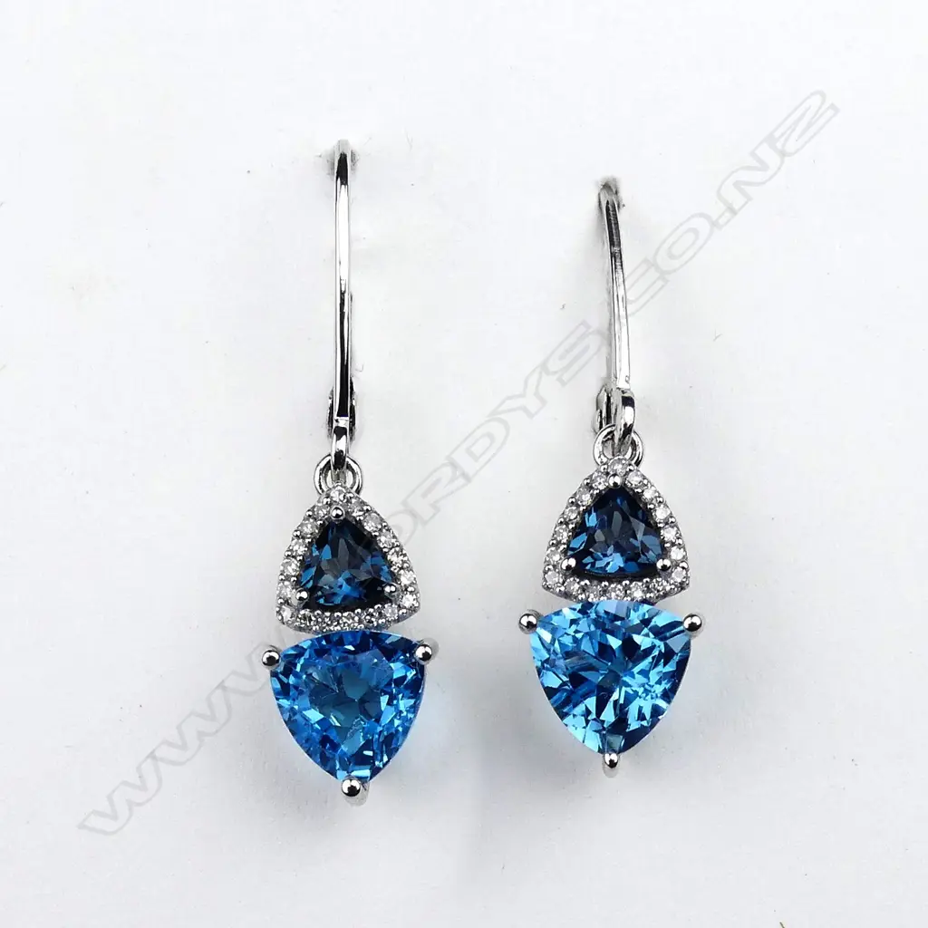 A pair of 10ct white gold topaz and diamond drop earrings Image 1++