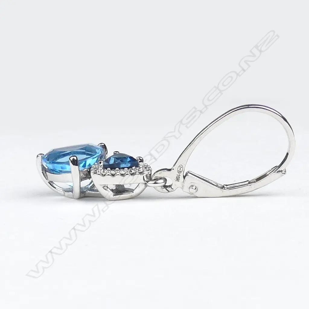 A pair of 10ct white gold topaz and diamond drop earrings Image 1++