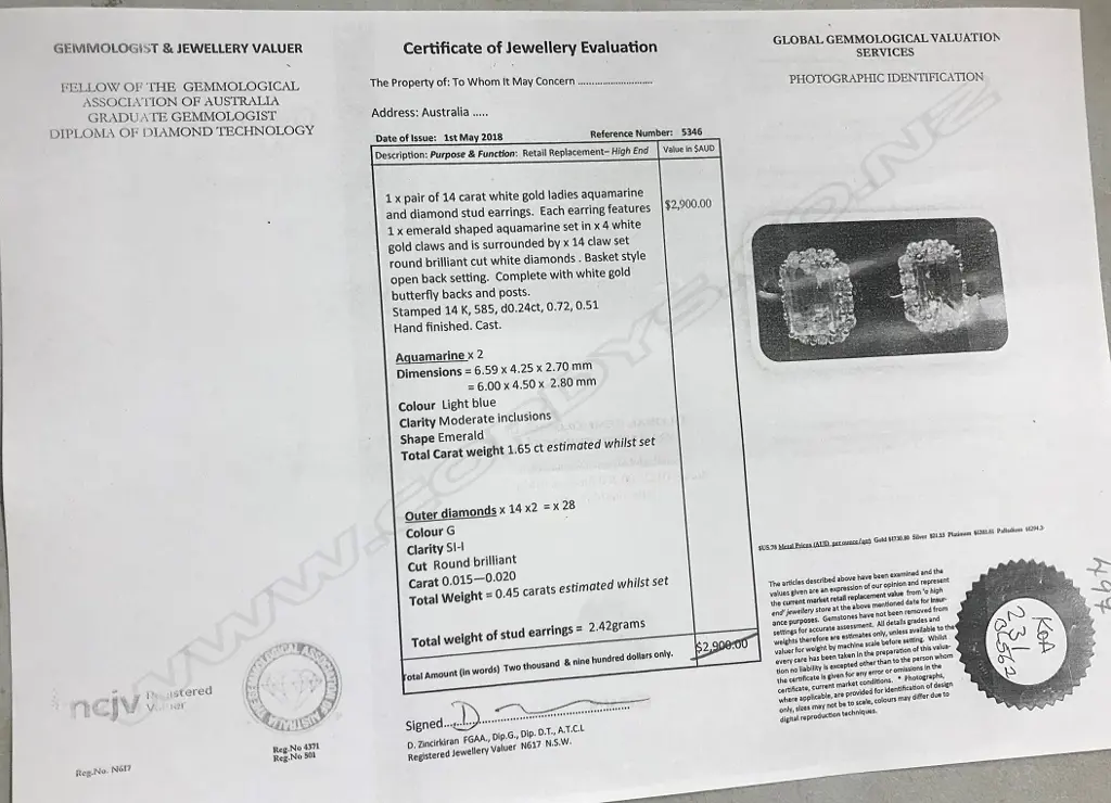 A pair of 14ct white gold aquamarine and diamond stud earrings Image 1++