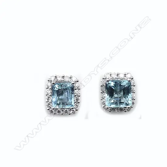 A pair of 14ct white gold aquamarine and diamond stud earrings
